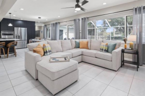 Paradise in Blue is a 5BR Contemporary Modern Screened in Heated Pool Home that Sleeps 12 in Temple Terrace Neighborhood near Busch Gardens & USF
